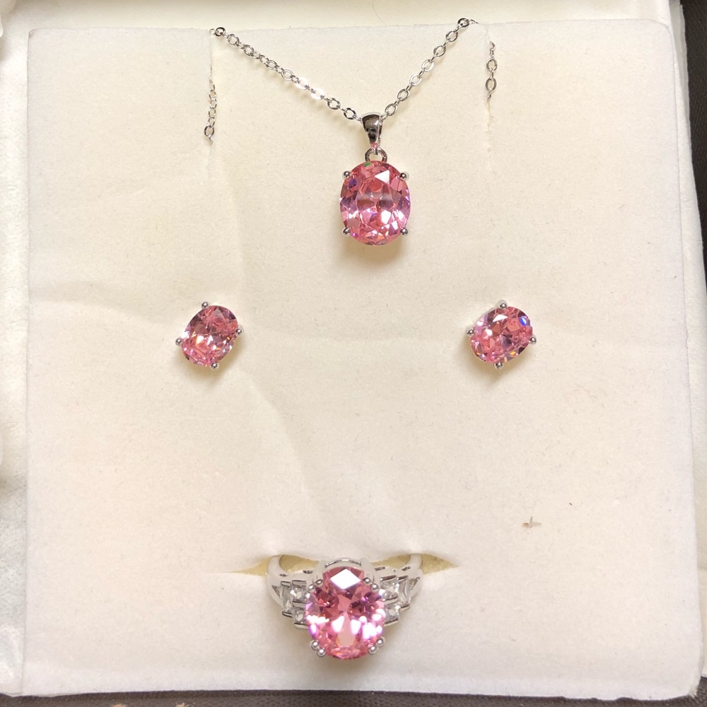 Pink earrings, necklace and ring. Never been worn.